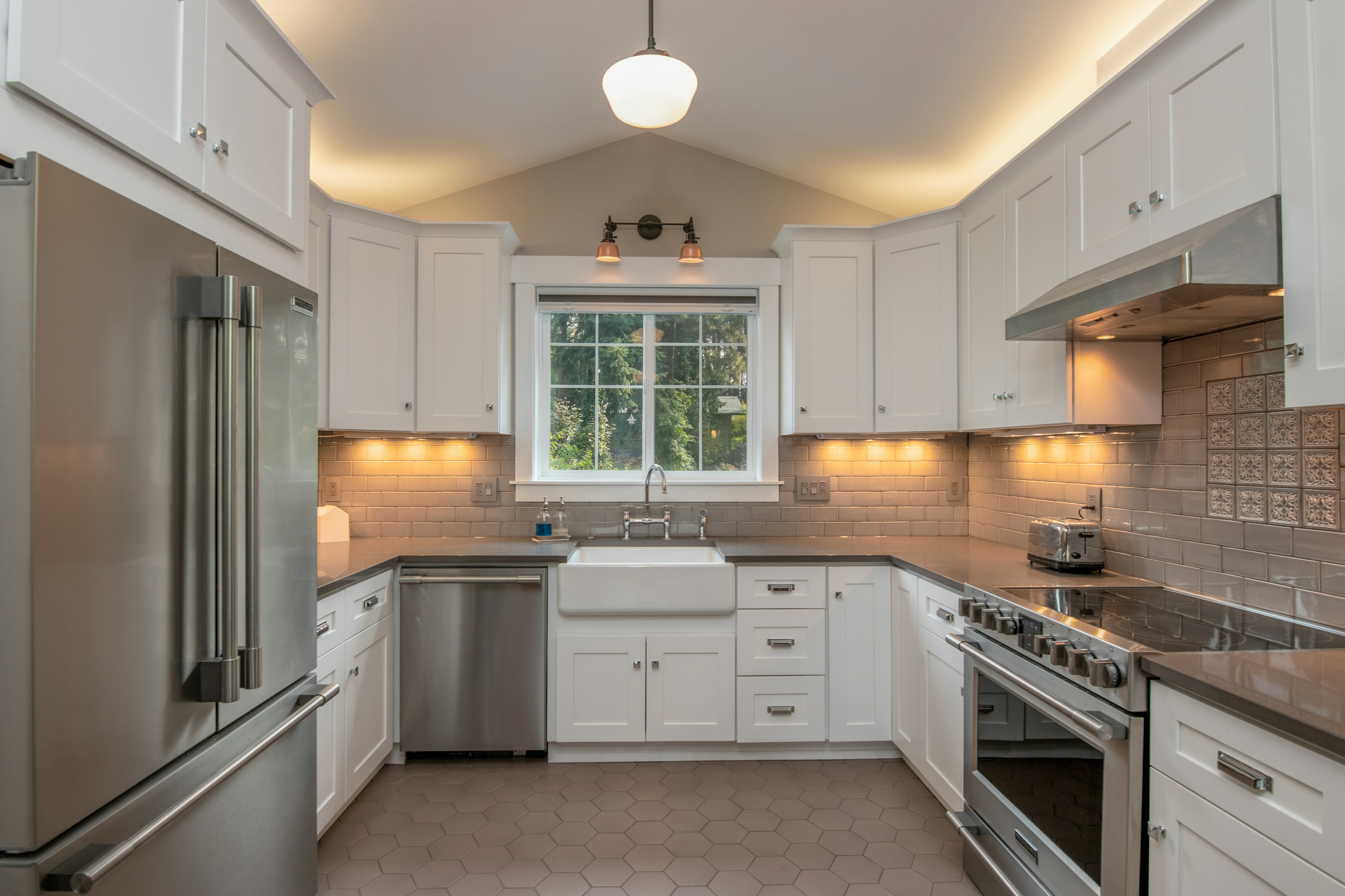 Secondary view of a custom kitchen cabinet installation with warm wood finishes
